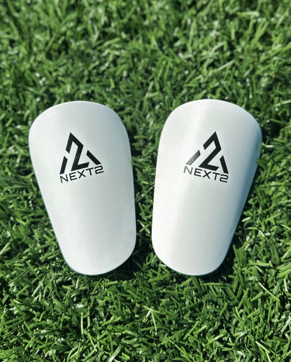 mini shin guards white